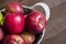 Basket in red apples, basket full of apples, apples pictures on authentic wood floor,