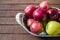 Basket in red apples, basket full of apples, apples pictures on authentic wood floor,