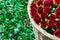 Basket with red roses on a grass background.Focus on roses.