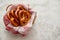 Basket with red and white checkered napkin filled with fresh brown pretzels