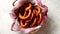 Basket with red and white checkered napkin filled with fresh brown pretzels