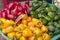 Basket of red, yellow and green capsicums