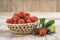 Basket with ripe arbutus unedo fruits