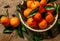 Basket with tasty tangerines