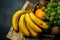 Basket of various fruits with bananas