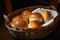 a basket of warm and crusty rolls, ready for sampling