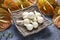 Basket of white tiny pumpkins and anthurium flowers