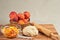 Basket of whole organic peaches, bowl of sliced peaches