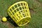 Basket of yellow golf balls