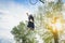 Basketball athlete doing huge slam dunk on the court in urban grunge camp with back light - Young man in action outdoor at sunset