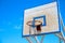 Basketball backboard on blue sky background. Rustic outdoor sport equipment. Summer outdoor activity concept