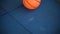 A basketball ball jumps on a rubber tile, slow mo, game