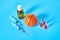 Basketball ball near syringe and ampoule, bottle on blue background. Concept of doping in sport