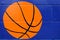 Basketball ball paint on blue wall
