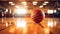 basketball ball sitting on top of a hardwood floor next to basketball hoops