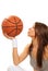 Basketball brunette woman player kissing ball