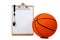 Basketball and clipboard on white