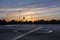 Basketball court in sunset after rain. Wet asphalt basketball court.