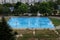 Basketball court wet from the rain in a residential area