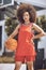 Basketball court, woman player or sports person with afro looking serious at training, workout and exercise or