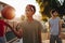 Basketball guys walking on street playing with the ball