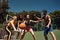 Basketball has a very fast and exciting pace of play. a group of sporty young people playing basketball on a sports