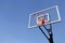 Basketball Hoop and Backboard against Blue Sky