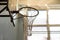 Basketball Hoop close-up against the spotlight in the school gym