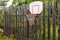 Basketball hoop on fence