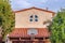 Basketball hoop mounted on red tile roof of home in Huntington Beach California