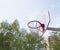 Basketball Hoop in the Park on a background green trees