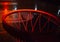 basketball hoop in red neon lights in sports arena during game