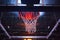 basketball hoop in red neon lights in sports arena during game