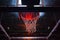 basketball hoop in red neon lights in sports arena during game