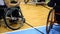 Basketball players in a wheelchair during a dead time a basketball game