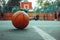 Basketball sits on court, blurred in background