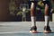 Basketball, sneakers and athlete black man standing on community sports court for match, motivation and streetball