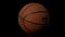 Basketball spinning on black background