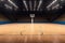 Basketball sport arena. Interior view to wooden floor of basketball court. Two basketball hoops side view. Digital 3D illustration