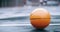Basketball sport ball in empty club asphalt court to play, train and practice for tournament game and training. Winter