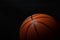 Basketball under the light with a black background