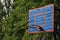 Basketball wooden backboard with a ring on an indoor yard