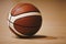 Basketball on Wooden Court Floor Close Up with Blurred Arena in Background