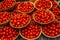 Baskets of cherry tomatoes at a farmers ` market in Oxford in Eng