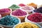 Baskets of colourful herbs and potpourri at a souk in Marrakech, Morocco