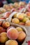 Baskets Of Ripe Peaches For Sale At Farmers Market