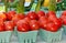 Baskets of tomatoes and asparagus for sale