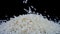 Basmati white rice falling on a black background