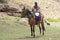 Basotho on his horse, coming back from shopping.