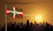 Basque lands Flag with building silhouette and sunset